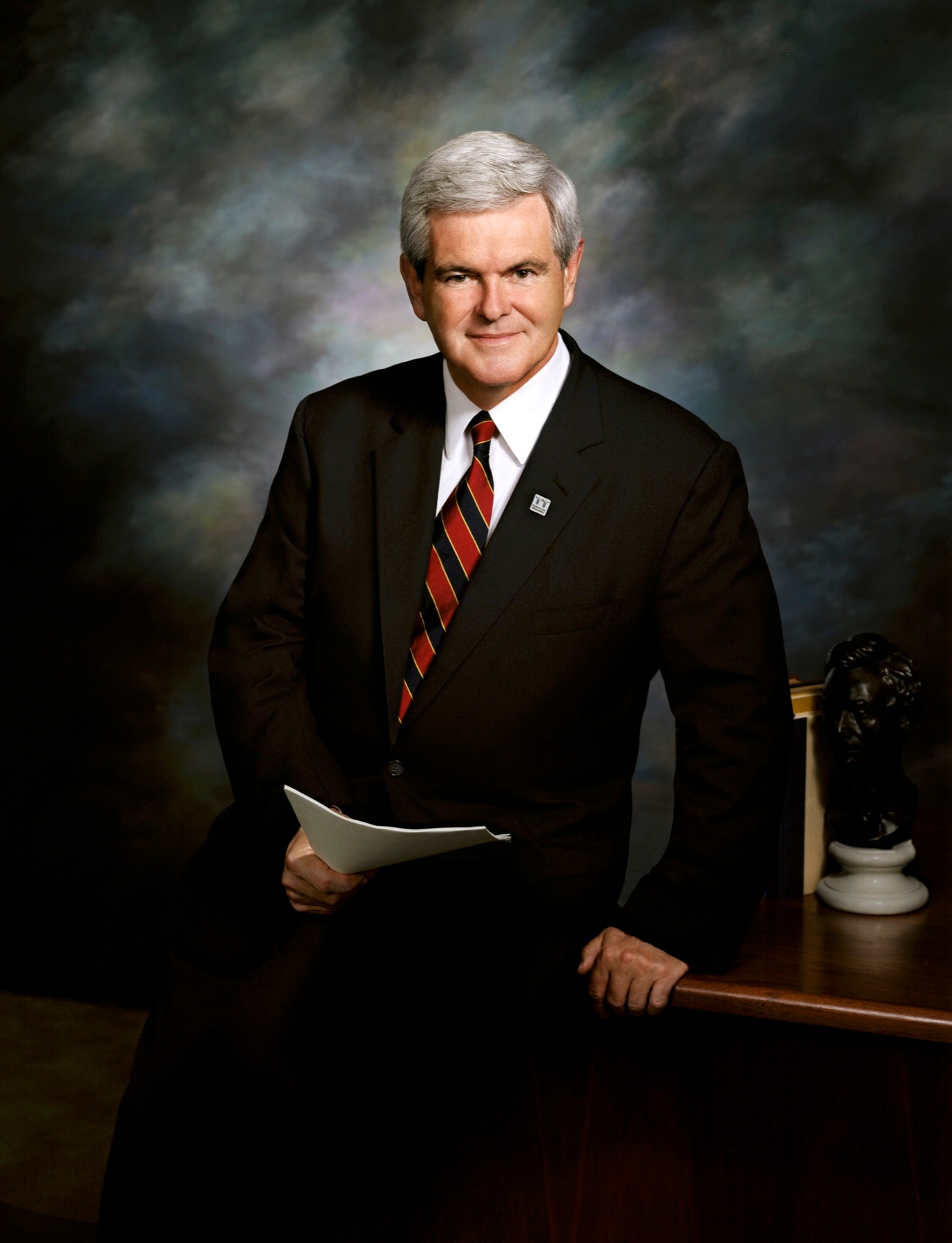 Newt Gingrich standing beside his desk in Washington
