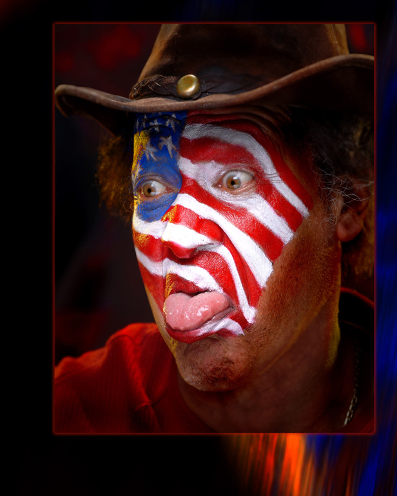 Artist and activist Paul Collins with his face painted as the American flag, photographed by David DeJonge