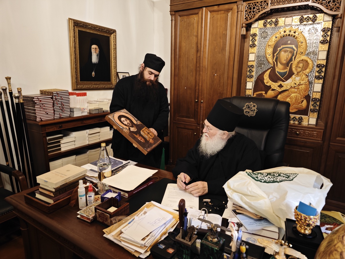 Father Alexios and Elder Ephraim of Vatopedi Monastery examining a Legacy Icons replica of the Christ Pantocrator from Sinai